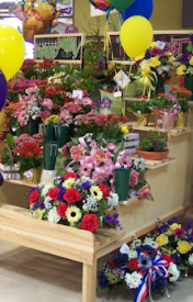 Floral merchandising fixtures, deli counters, Euro slant tables